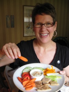 Annie enjoys Mary's delicious RAW hummus!