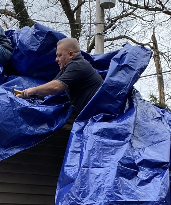 Eddie trying to install tarp